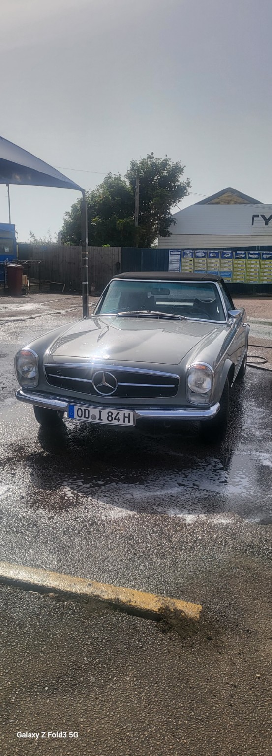Classic silver Mercedes at the car wash