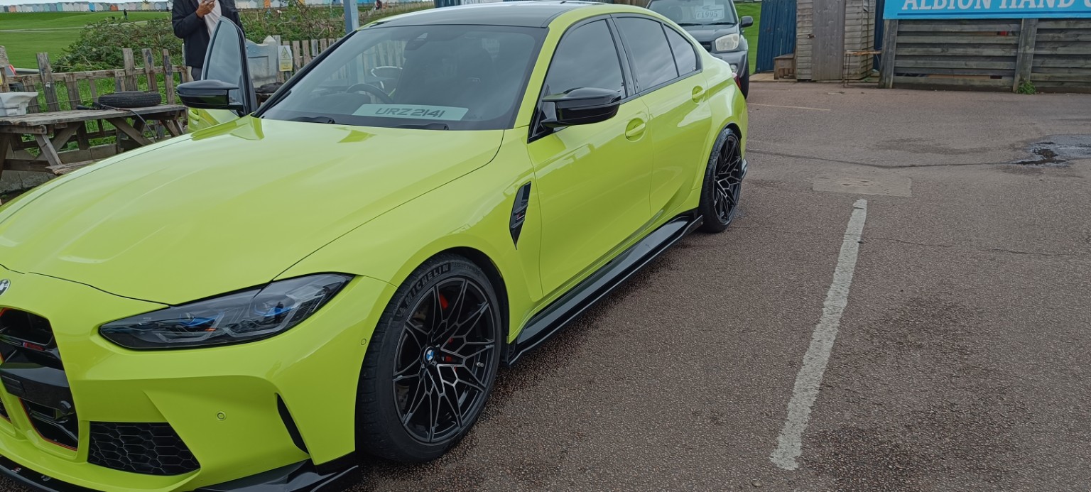Green performance car after valeting