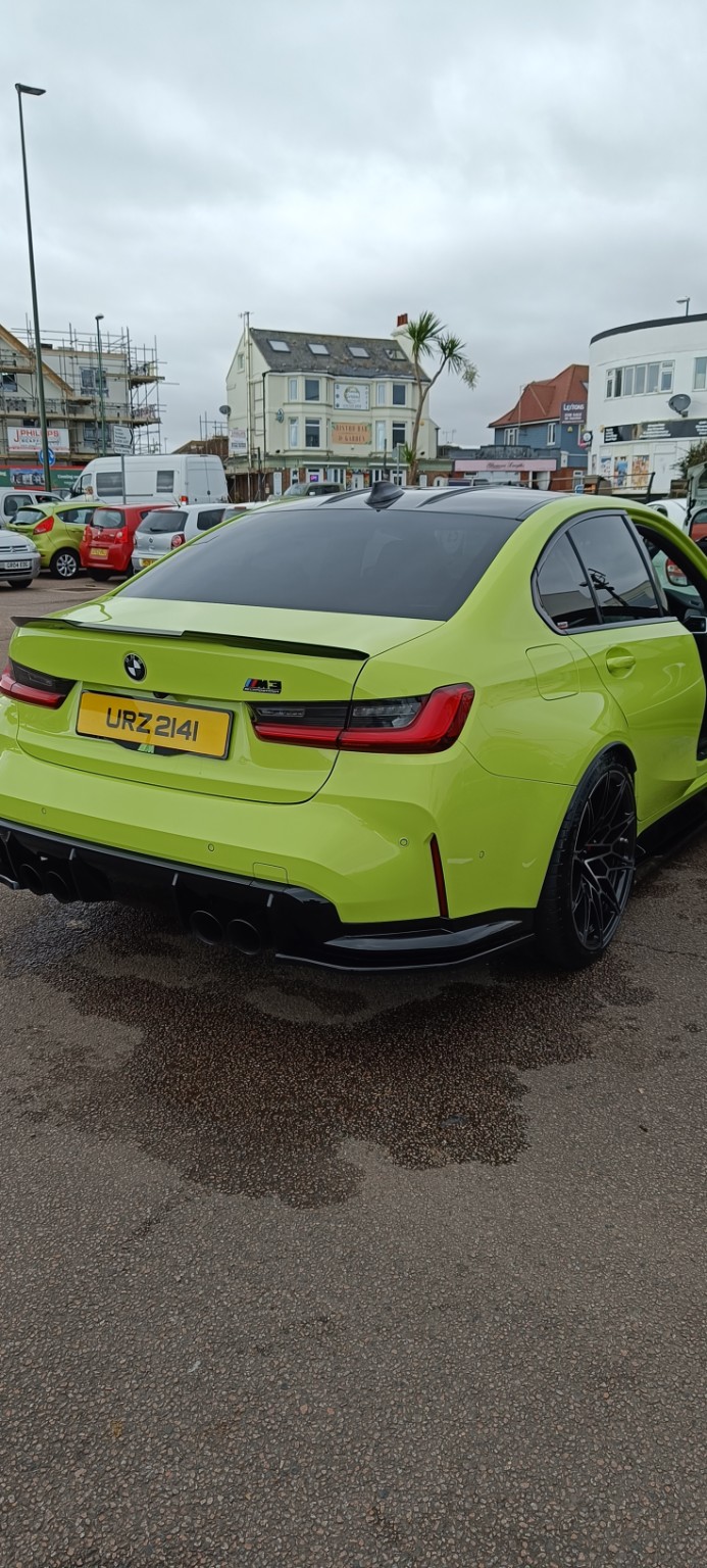 Green BMW rear after valeting